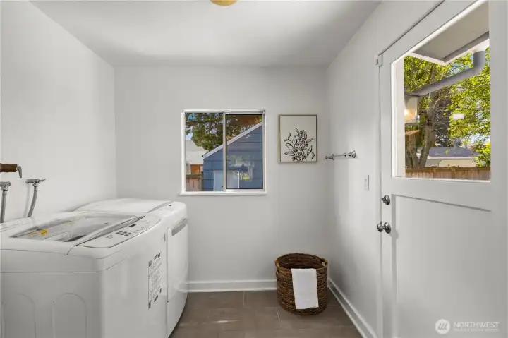 Laundry room, with a door that leads you to the backyard.
