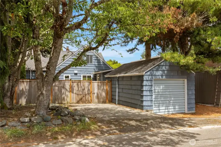 Additional parking and a detached garage/shop with alley access.