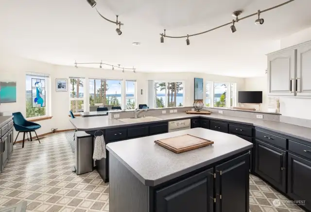 Stay engaged with those you love as you prepare meals. This kitchen delivers big time with loads of counter space and storage. Not to mention those views!