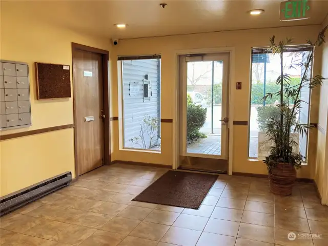 Secure lobby entrance with covered entryway. Tile floor. Quick elevator access. Mail box location. Fire sprinkler system throughout.