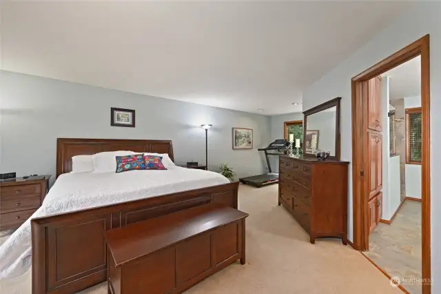 The primary suite is a luxurious retreat with remodeled ensuite bath.