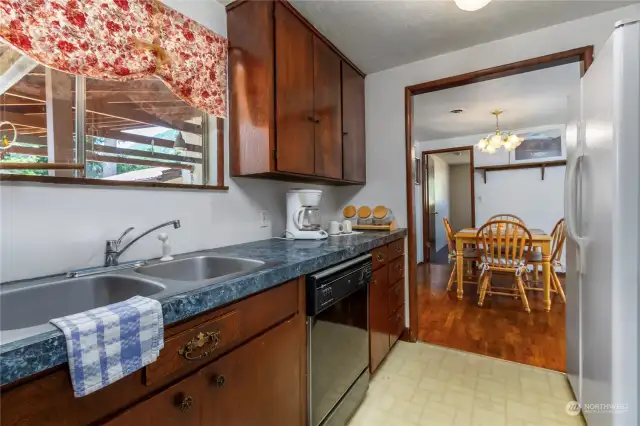 Looking across the dining room, there is the door for a bedroom