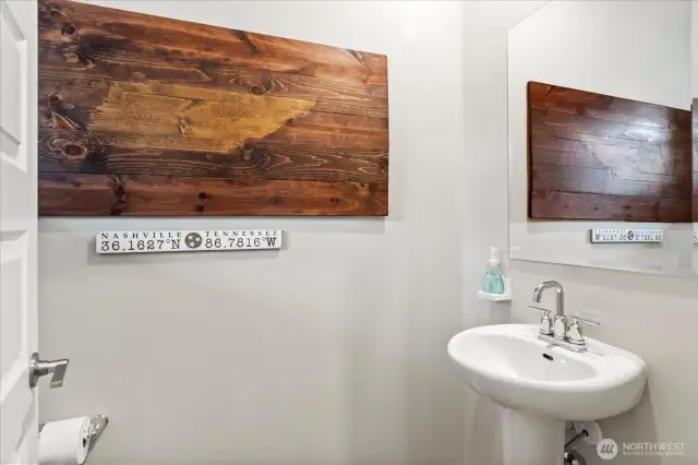 Main level half bath is located just off the entry.