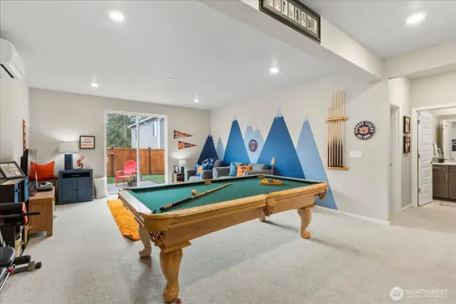 Fully finished Lower Level features high ceilings and access to the patio and fully-fenced backyard.