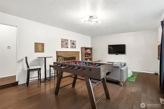 Wood floors bring warmth, while the updated midcentury light adds a chic touch. This is the kind of space where style and functionality come together effortlessly.