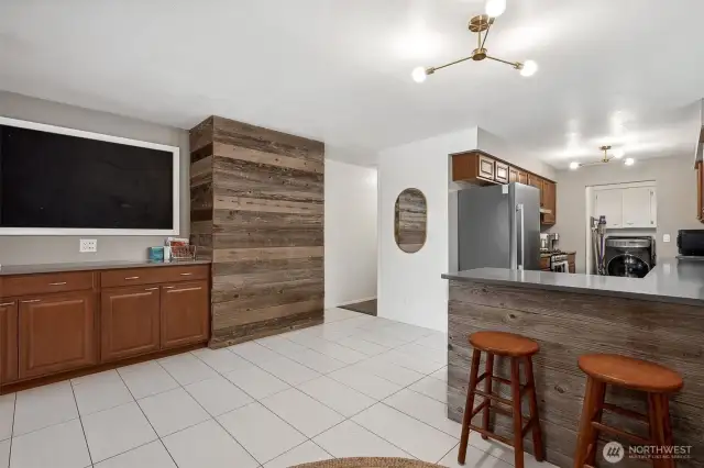 The wood plank details give this kitchen a cozy vibe, but the real star is the buffet counter—extra-long, extra-functional, and packed with storage to keep your space looking effortlessly organized.