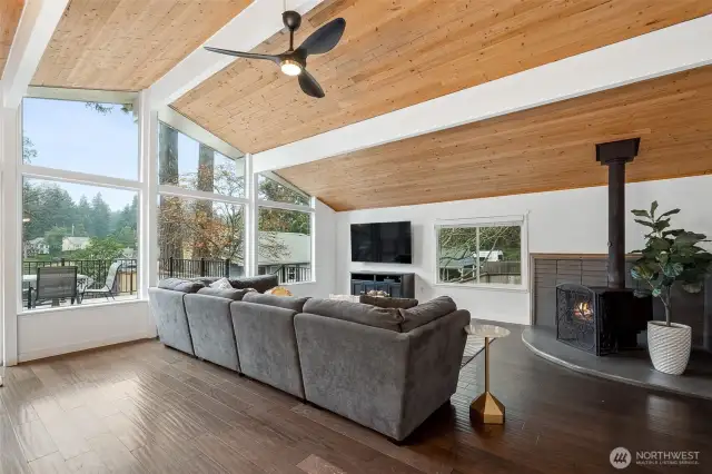 Wood stove corner? Check. Textured wood floors? Absolutely. And the best part: a view that opens up to your deck and Long Lake beyond. This family room is as functional as it is pretty. Also, all of the furniture in this house is negotiable!
