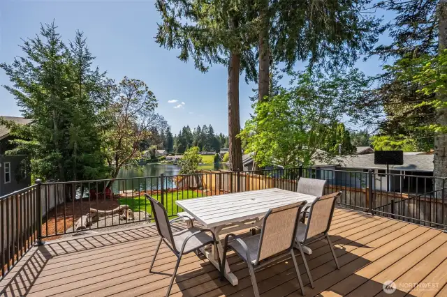 Welcome to your brand new wood deck with breathtaking views overlooking the lake and the new lawn.