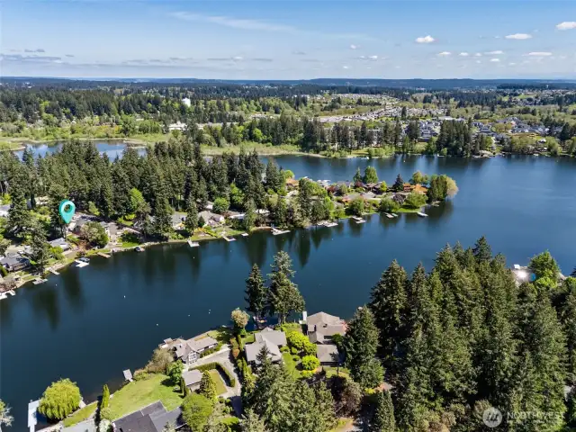 More Lawn, Less Labor. From the perfect, lush lawn to the mulching framing the edges, this backyard is designed for easy care. So you can spend more time enjoying the lake and less time sweating over yard work. It’s the kind of space that gives you a break, without sacrificing beauty.