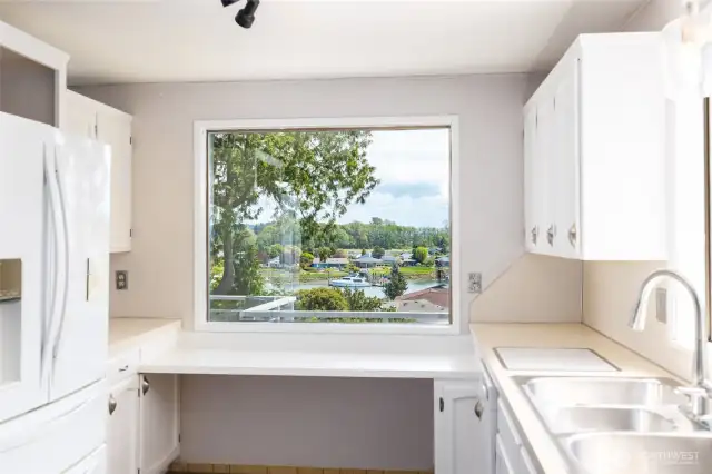 Wonderful view of the channel/canal with built in prep area/plant shelf/desk.