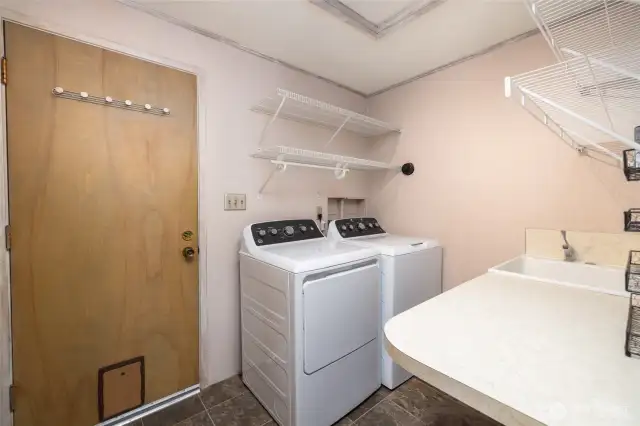 Full service laundry room with garage access.