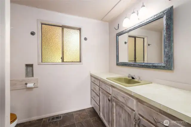 3/4 guest bath on the main level. Check out the iconic 70's flair!