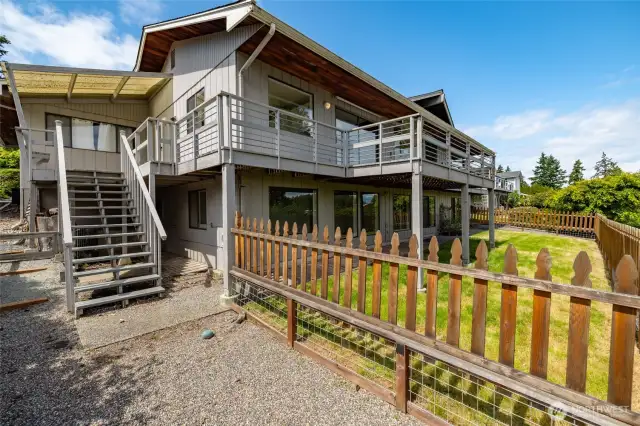Fully fenced back yard and dog area.