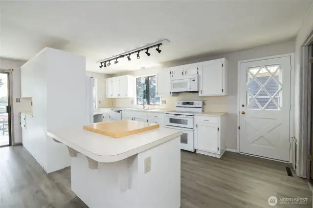 New flooring throughout kitchen and dining room.