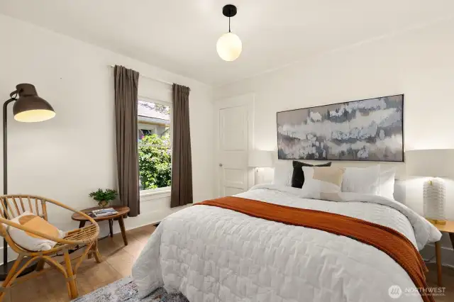First of two bedrooms, closet to the left of the bed.