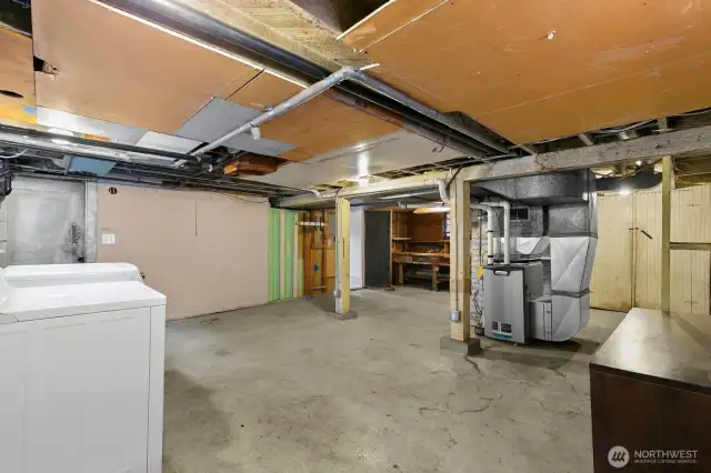 Basement is exterior access but is fully covered by the roof. Enter into the unfinished basement. Laundry to your left.