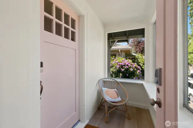 This cute enclosed porch offers a perfect sunny spot for morning coffee.