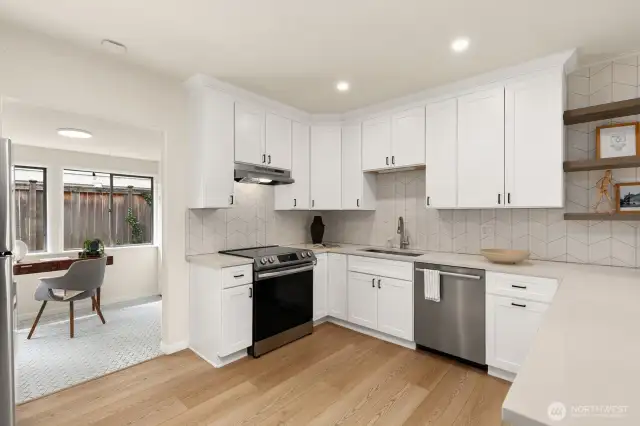 Fully updated and modern kitchen. There is no shortage of cabinet or counter space here!
