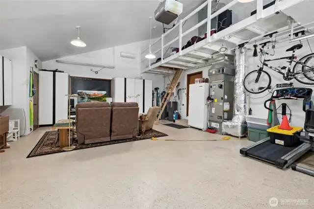 2 car garage has terrific built in storage, mini split for heat & cool & loft space access for more storage