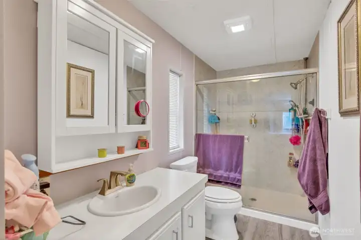 Primary bathroom with large walk in shower.