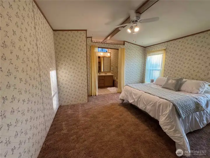 Spacious primary suite with double closets.