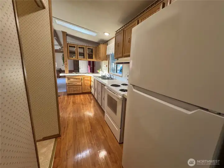 Looking back at the kitchen and living room from primary suite.
