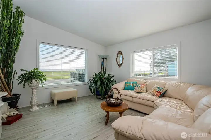 Spacious formal living area with lots of light & spectacular bay & Mt views!