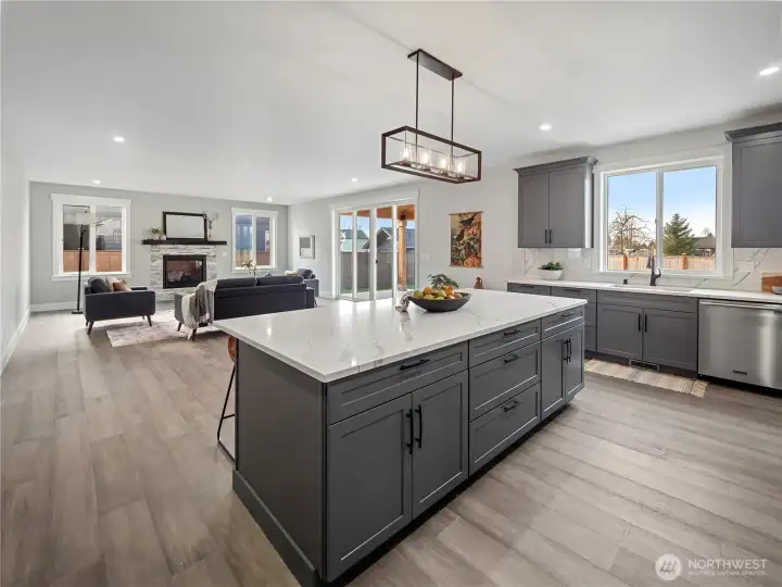 Open concept kitchen, living, & dining.