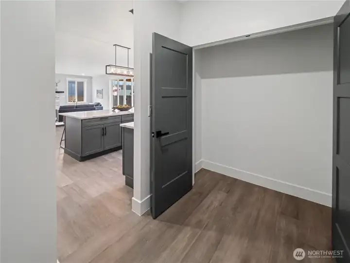 Pantry/Utillity storage room off of kitchen leads to garage.