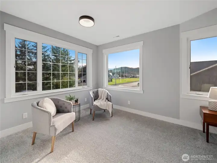 Sitting area and/or reading nook with tons of natural light.
