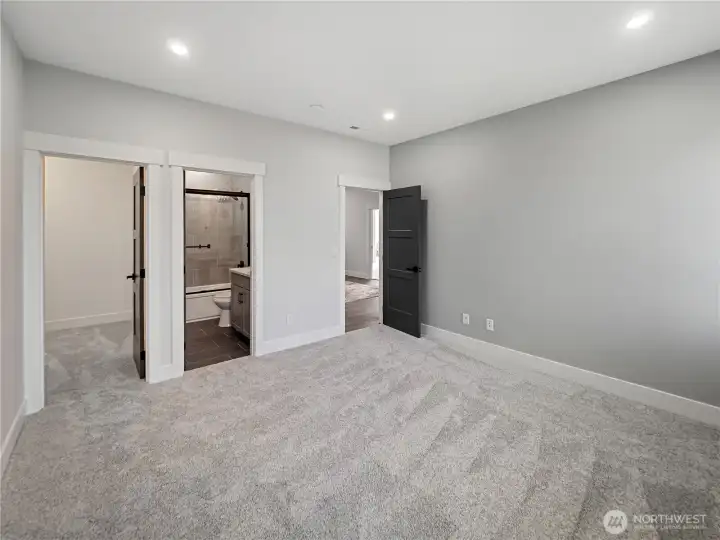 Guest bedroom #1 with full bath & walk-in closet.