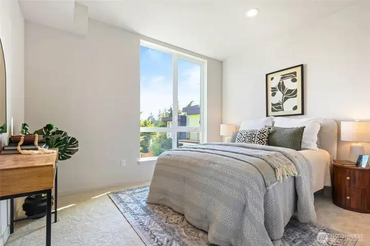 Sunlit and serene, this bedroom makes the perfect guest room, home office, or restful retreat.