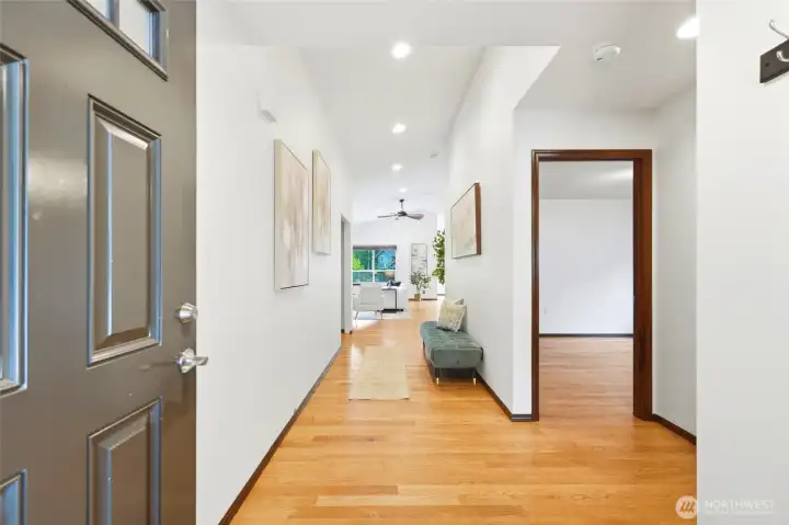 Inviting entry with hardwood floors, soaring ceilings, and a seamless flow that draws you into the main living area.