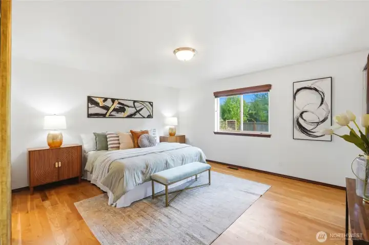 Spacious primary bedroom with great natural light and a comfortable, open feel.