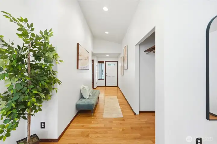 Hallway leading back toward the front of the home, where bedrooms 2 and 3 are located.