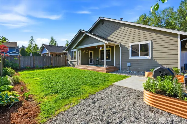 Low-maintenance yard with a mix of lawn, patio space, and room to enjoy the outdoors.