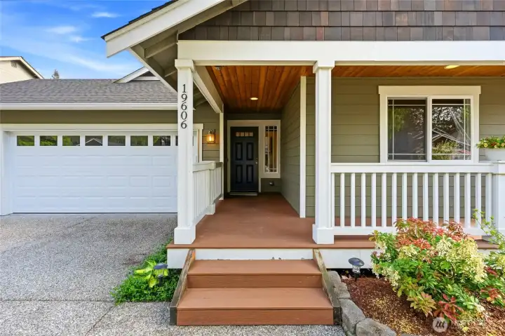 Inviting covered front porch, perfect for morning coffee or greeting guests.