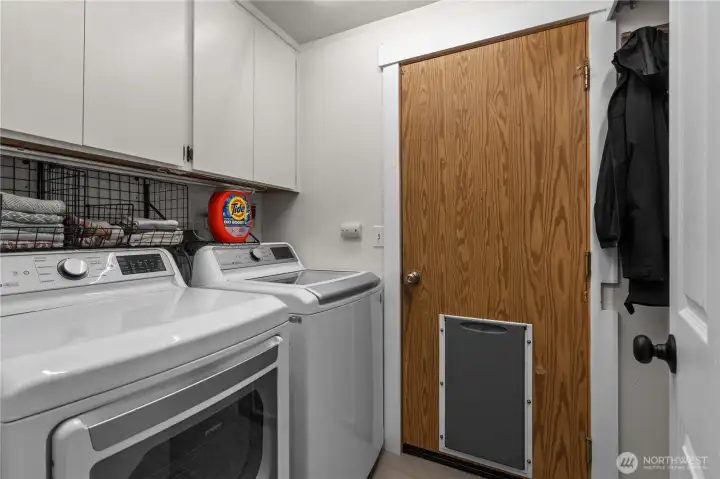 Laundry Room w/Cabinets and access to Garage.