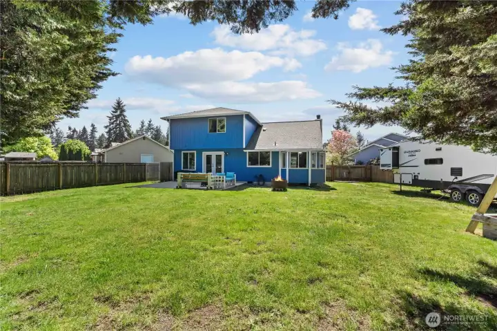 Huge 1/3 Acre Fully Fenced Property with RV Parking, Patio and Firepit Area.