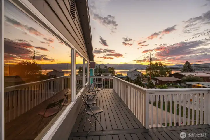 Twilight view of main level lake view deck. Twilight view of main level lake view deck.