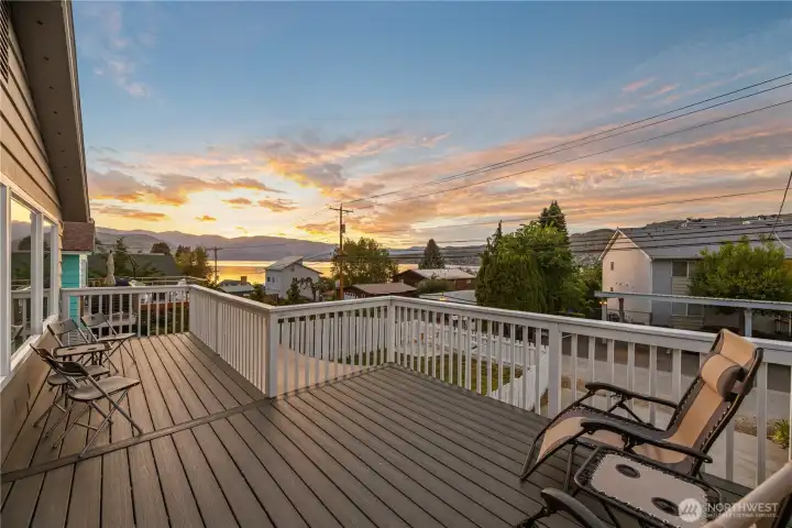 Twilight view of main level lake view 240sf deck. Twilight view of main level lake view 240sf deck.