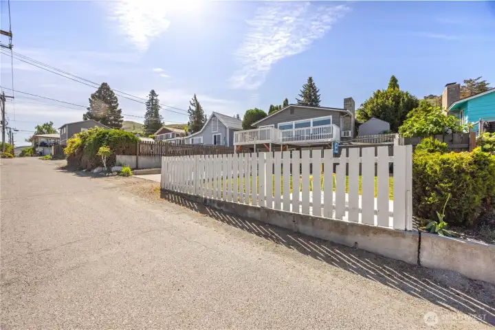 Exterior view of home and fenced outdoor living area. Exterior view of home and fenced outdoor living area.