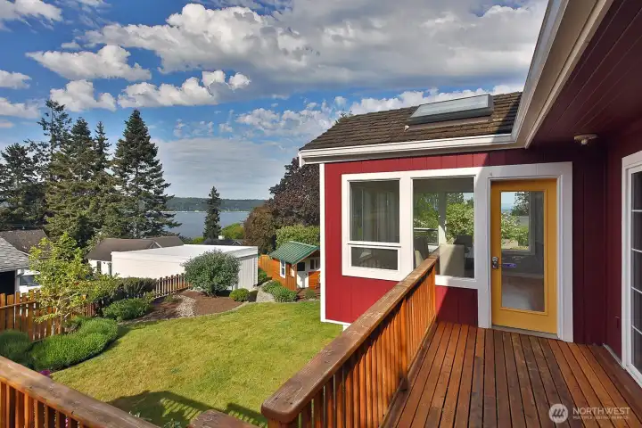 Door leading out from the dining area to the outdoor deck and views.