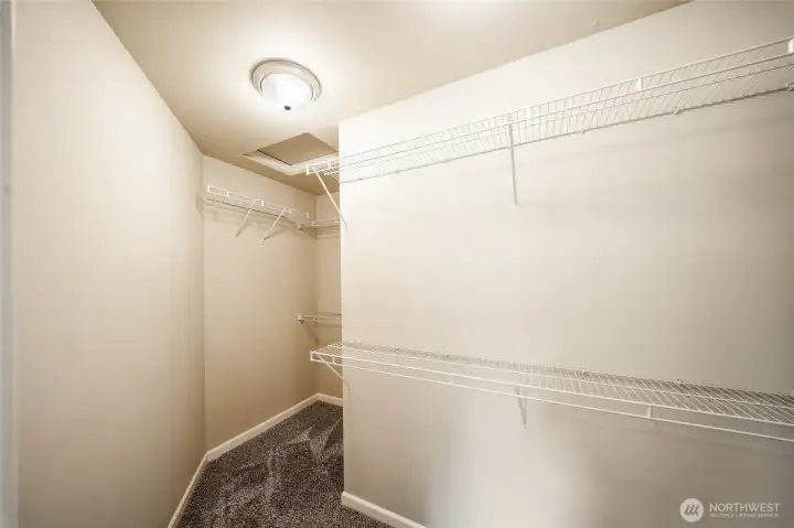 Primary walk-in closet. Primary walk-in closet.