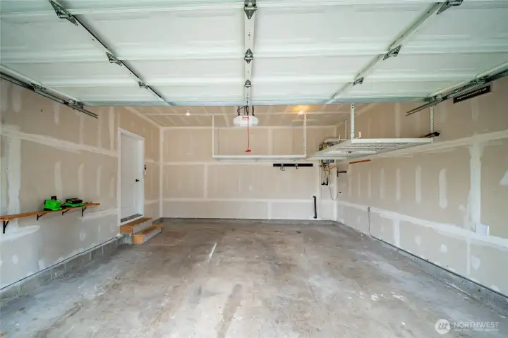 Tankless water heater and great shelves for storage in the garage. Tankless water heater and great shelves for storage in the garage.