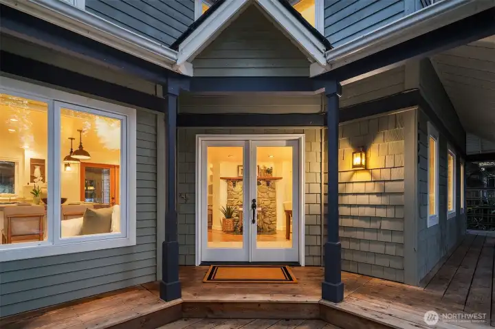 Welcoming front entrance surrounded by storybook gardens and stonework Welcoming front entrance surrounded by storybook gardens and stonework