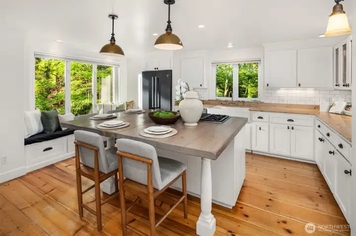 Gorgeous kitchen island made from reclaimed wood make this a very special gathering place with Built-in bench seat with views into the gardens Gorgeous kitchen island made from reclaimed wood make this a very special gathering place with Built-in bench seat with views into the gardens