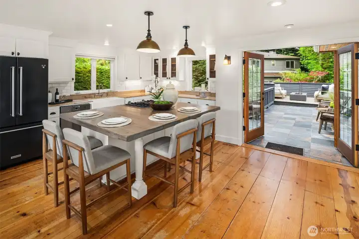 Kitchen flows seamlessly to the private deck for effortless entertaining Kitchen flows seamlessly to the private deck for effortless entertaining