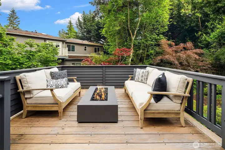 Deck off of kitchen complete with fire pit Deck off of kitchen complete with fire pit