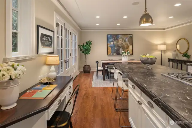 Chef’s kitchen with stone counters and high-end appliances.